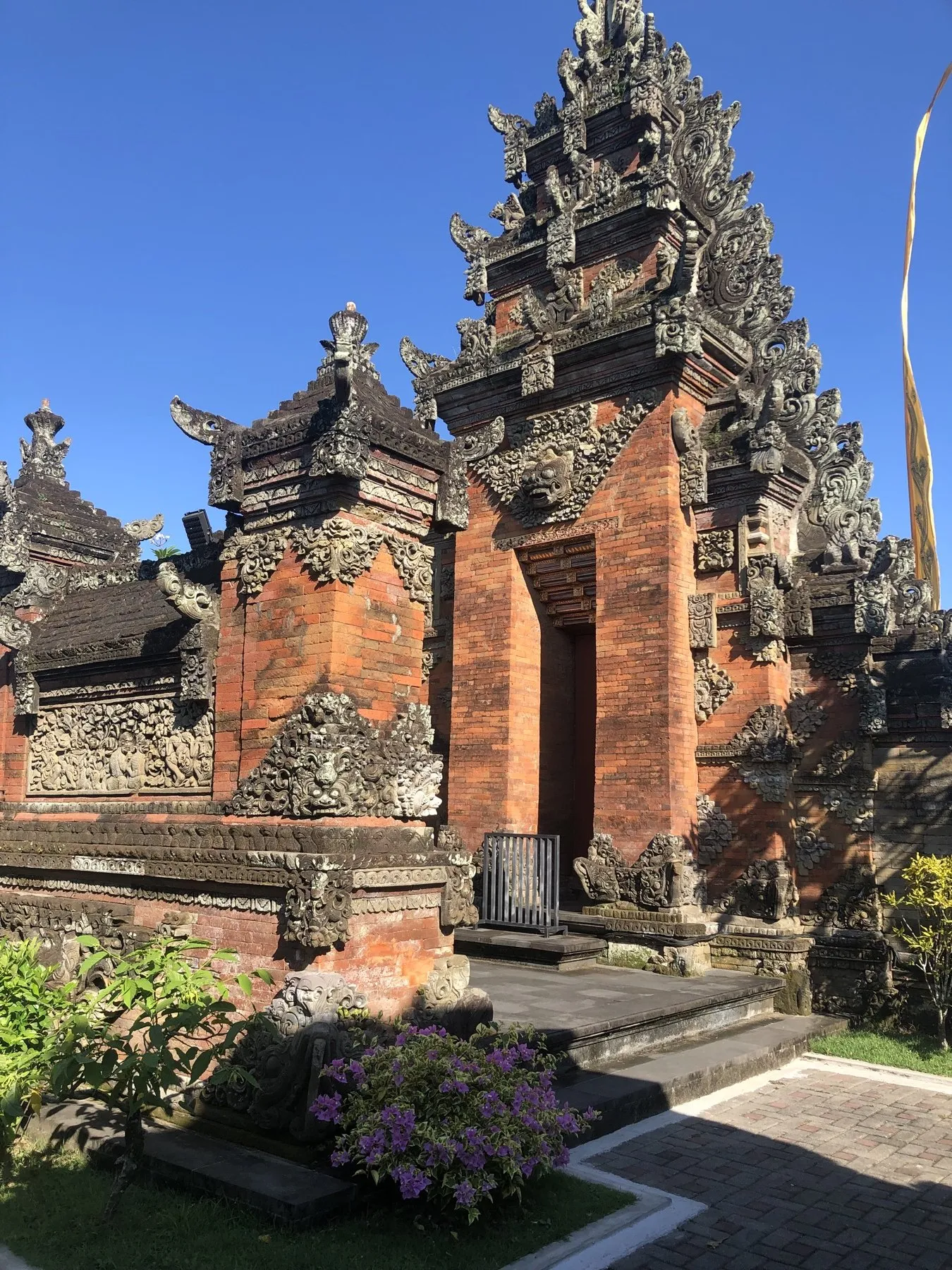 Balinese temple entrance with carved brick and stone